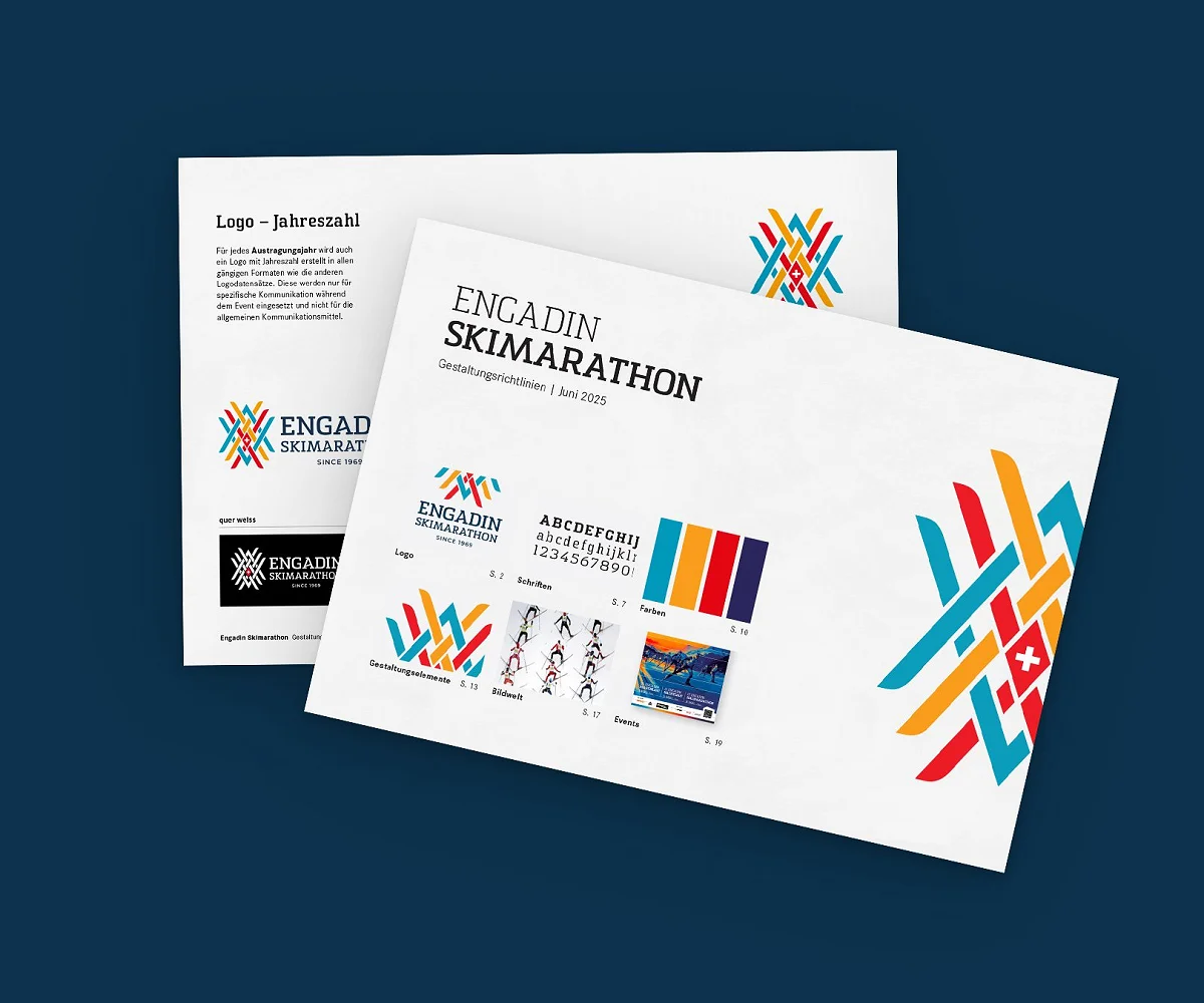 Titelseite und Logoseite der ESM-Gestaltungsrichtlinien angeschrägt auf dunkelblauer Fläche